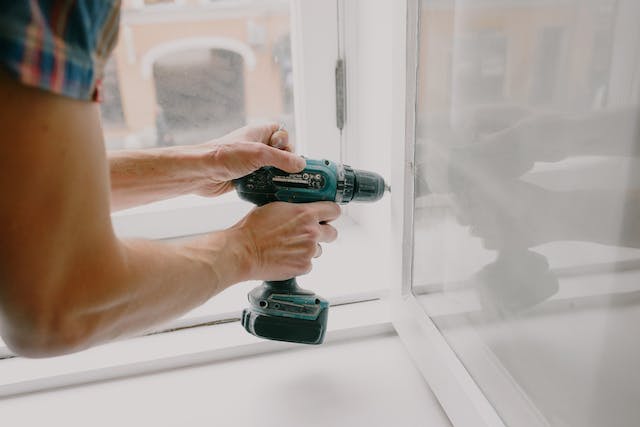 a-person-repairing-a-window